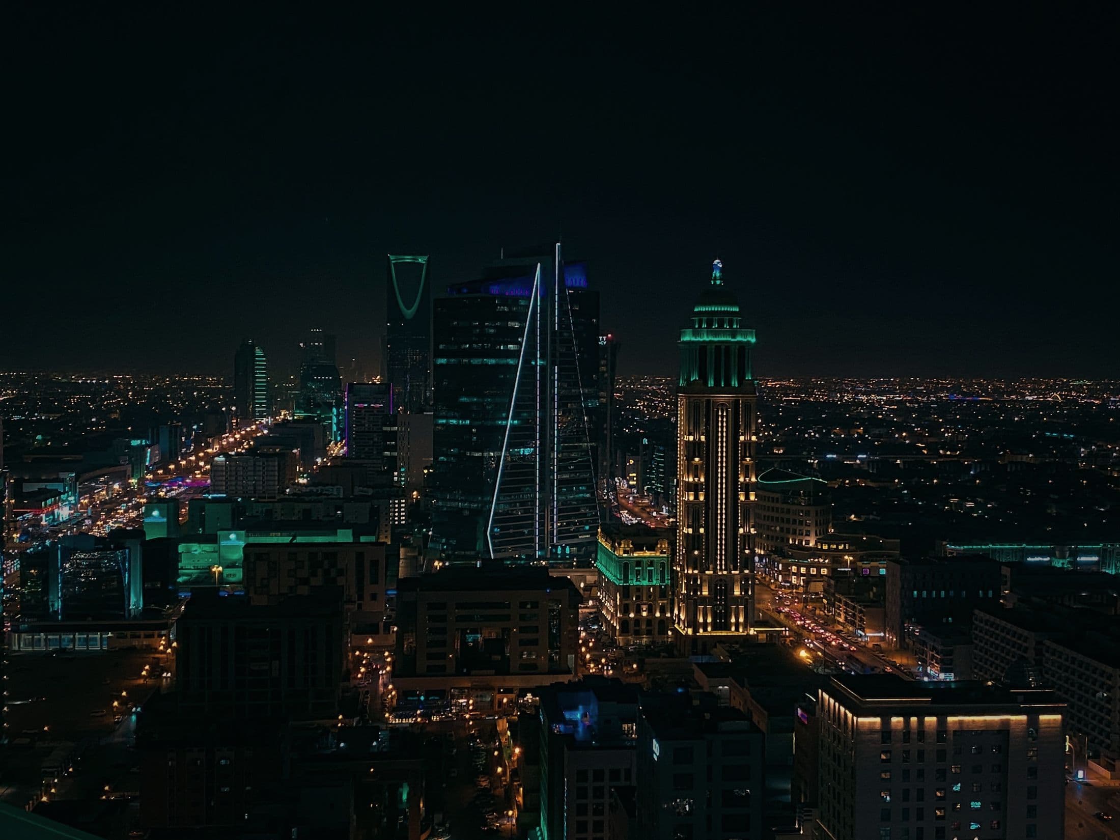 Riyadh at night, seen from above, with the Kingdom Centre tower lit
